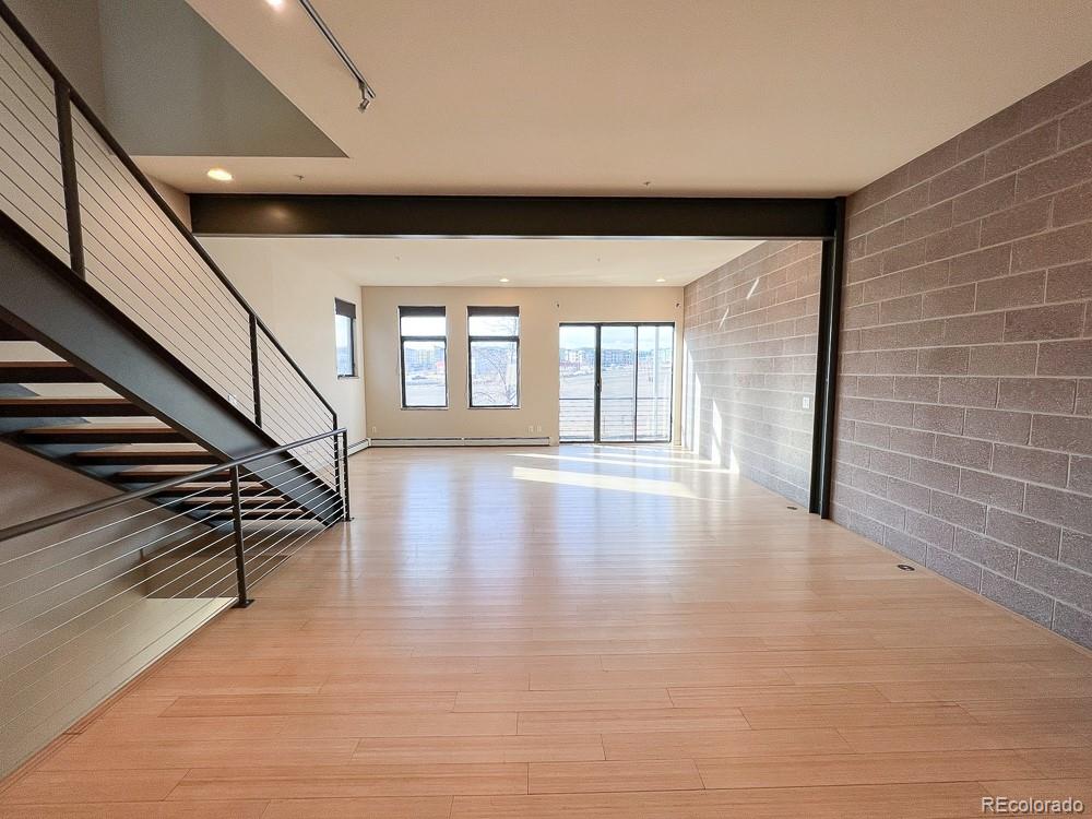 11570 Colony Row Broomfield, CO 80021 - Photo 16 of 24 a view of an entryway with wooden floor