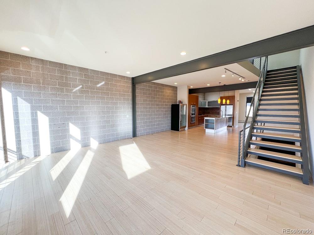 11570 Colony Row Broomfield, CO 80021 - Photo 19 of 24 a view of livingroom with furniture and wooden floor