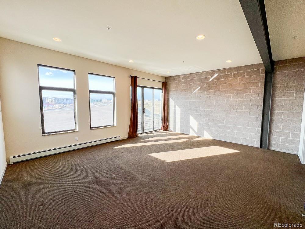 11570 Colony Row Broomfield, CO 80021 - Photo 23 of 24 an empty room with windows and entrance