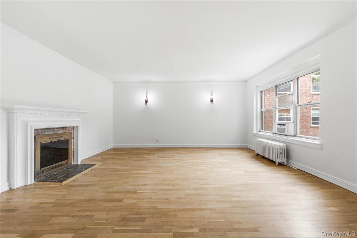 250 Bronxville Road, Unit 4H Bronxville, NY 10708 - Photo 6 of 18 Very spacious living room with wood burning fireplace