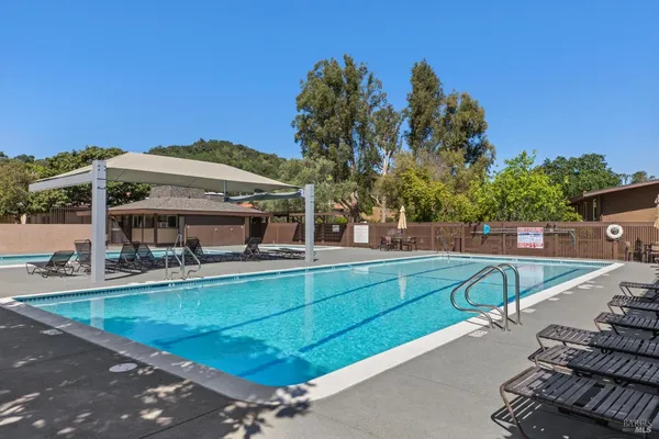 a view of a swimming pool with a patio