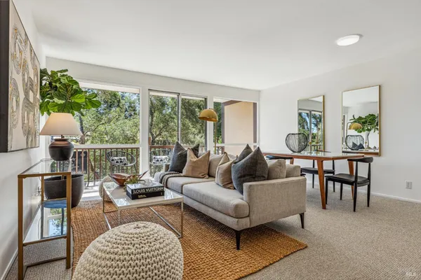 a living room with furniture and a table
