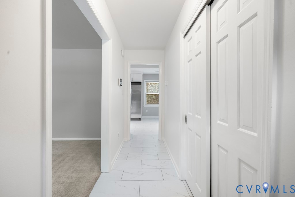 207 Missionary Ridge Hampton, VA 23669 - Photo 6 of 32 Hallway featuring light-toned tile flooring, white