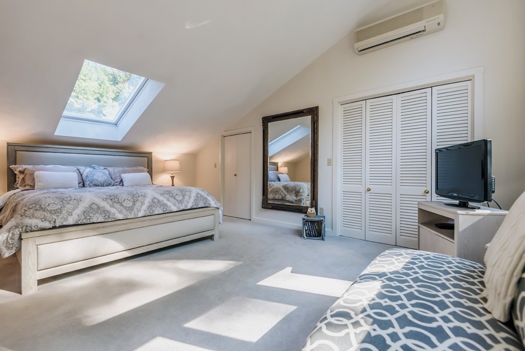 351 Main Street Boxford, MA 01921 - Photo 13 of 30 a bedroom with a bed and a flat screen tv