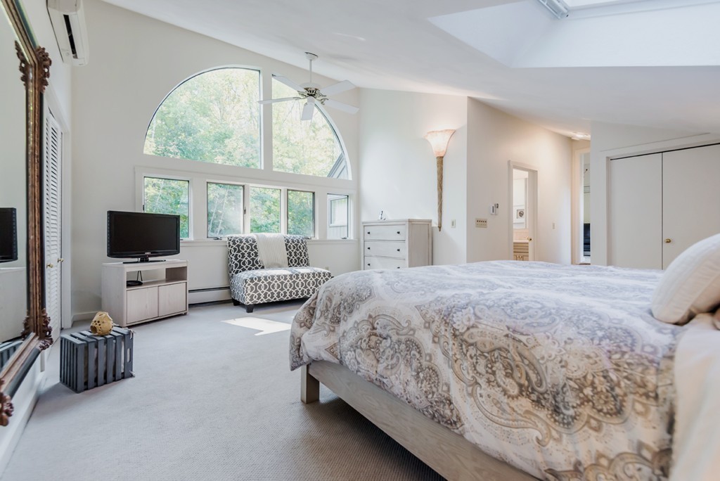 351 Main Street Boxford, MA 01921 - Photo 15 of 30 a spacious bedroom with bed and a flat screen tv