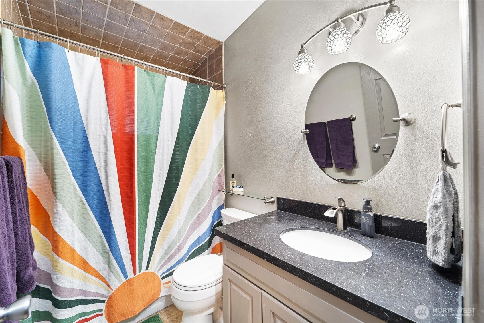 18308 Southeast 145th Street Renton, WA 98059 - Photo 14 of 26 a bathroom with a granite countertop sink a mirror a toilet and a window
