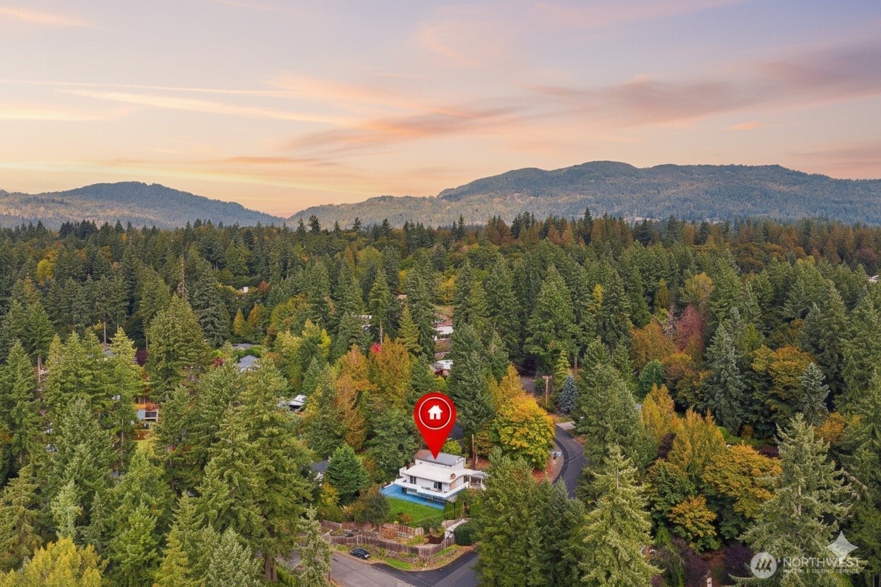 18308 Southeast 145th Street Renton, WA 98059 - Photo 25 of 26 a view of a lush green field with mountains in the background