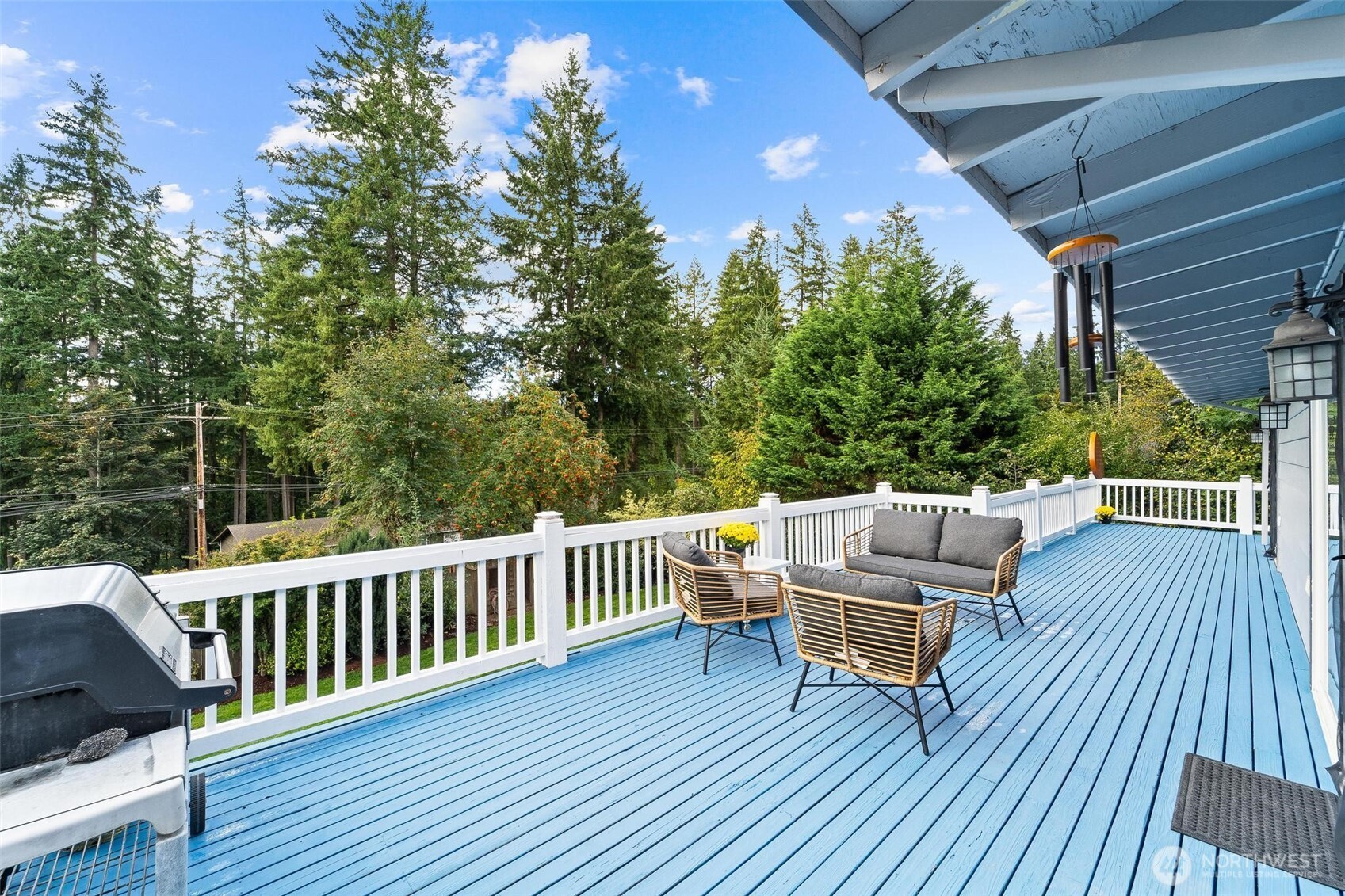18308 Southeast 145th Street Renton, WA 98059 - Photo 3 of 26 a balcony with wooden floor table and chairs