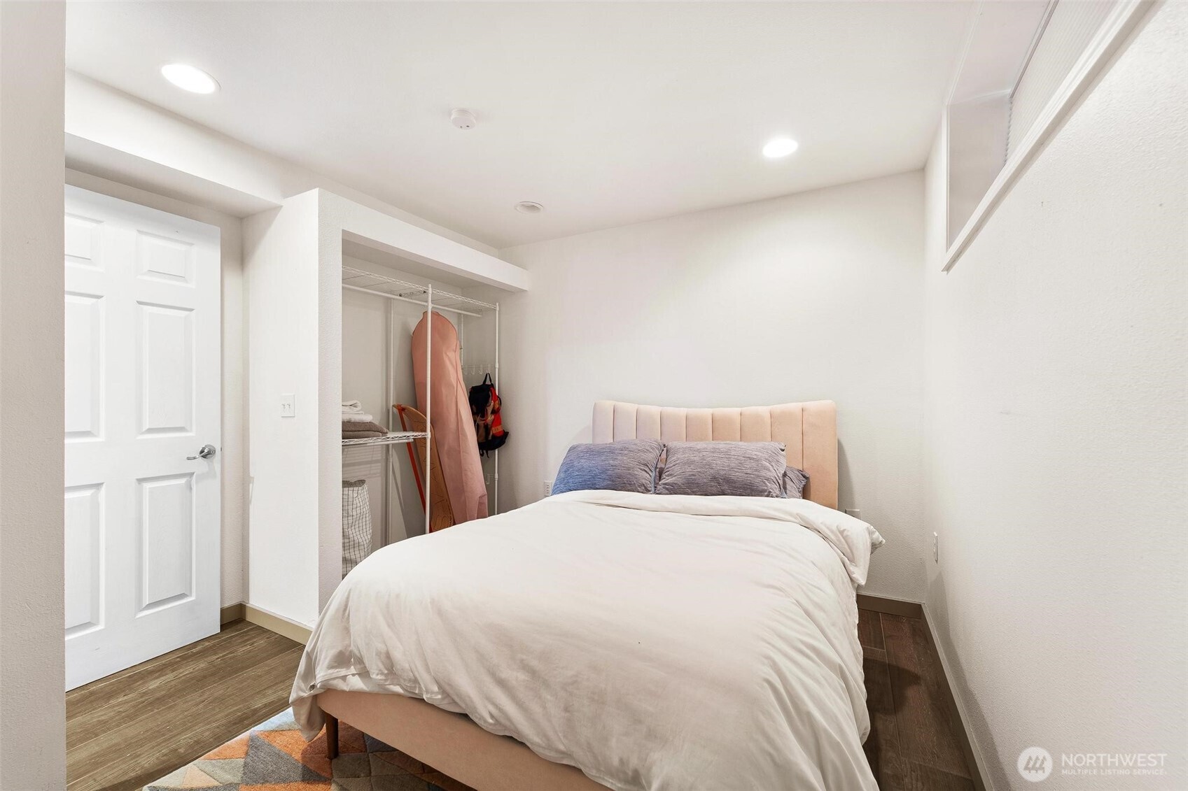 18308 Southeast 145th Street Renton, WA 98059 - Photo 9 of 26 a bedroom with a bed and wooden floor