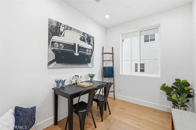 a work room with furniture and wooden floor