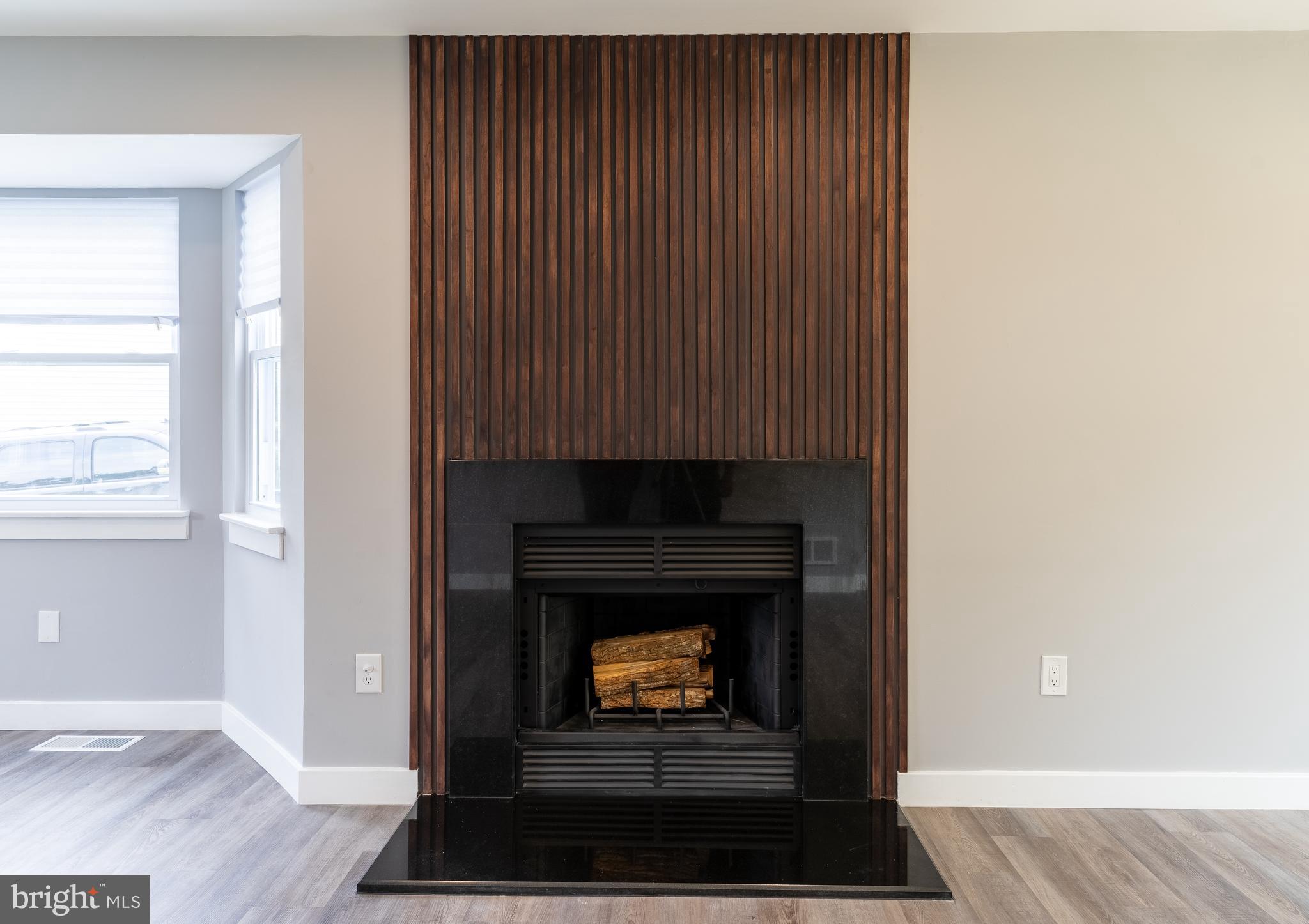 7010 Glen Spring Road Windsor Mill, MD 21244 - Photo 6 of 47 Custom Wood Slat/Granite Fireplace