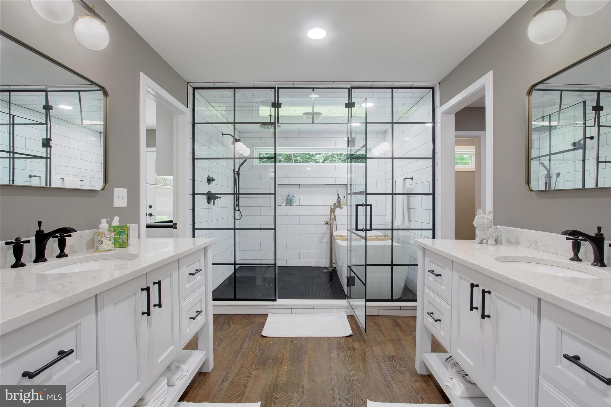 1855 Westwood Road York, PA 17403 - Photo 27 of 60 a bathroom with a double vanity sink a toilet and shower