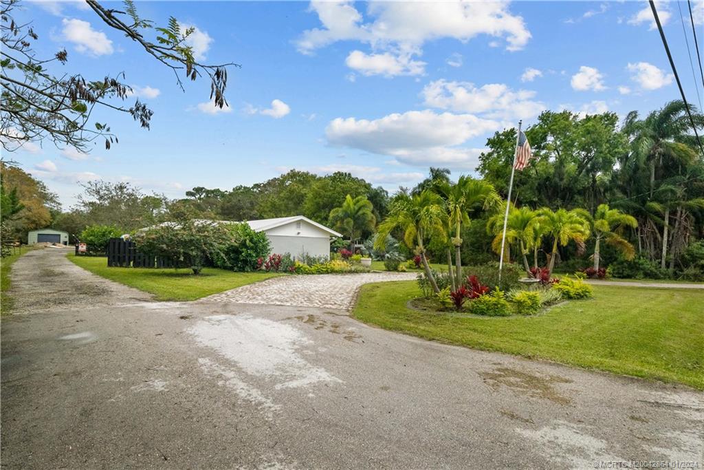 4911 Jorgensen Road Fort Pierce, FL 34981 - Photo 14 of 43 a view of a house with a big yard