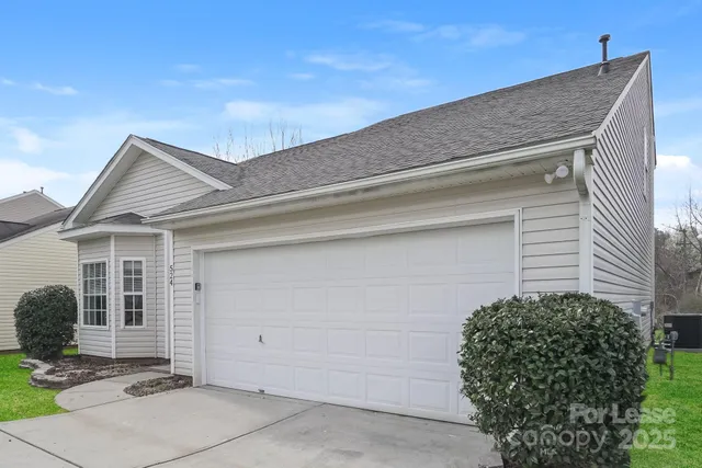 a view of a house with a garage