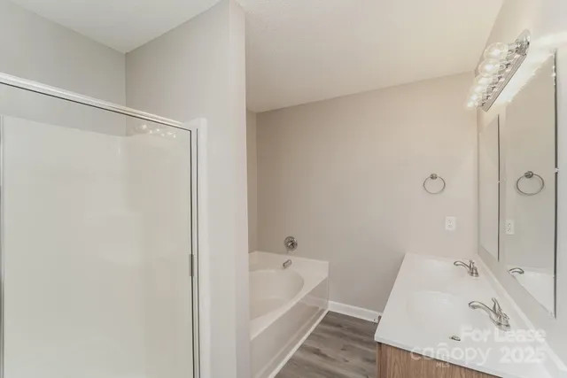 a bathroom with a tub and a sink