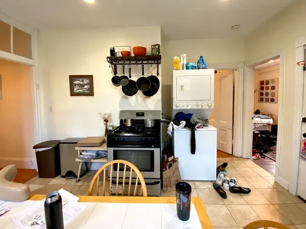 a kitchen with a sink and a stove top oven