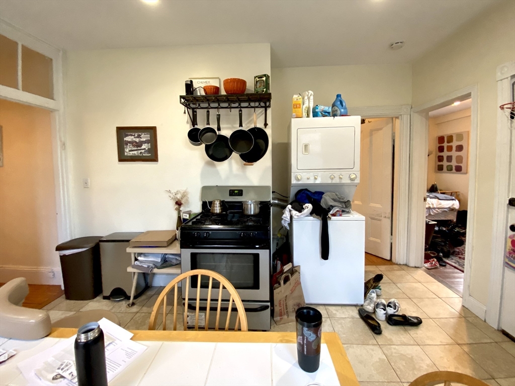 a kitchen with a sink and a stove top oven