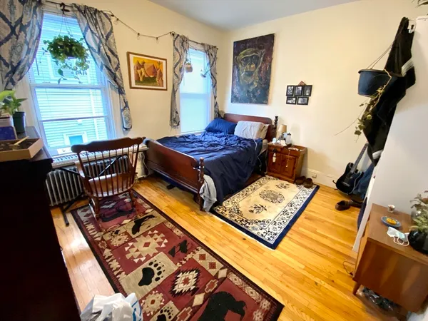 a living room with furniture rug and window