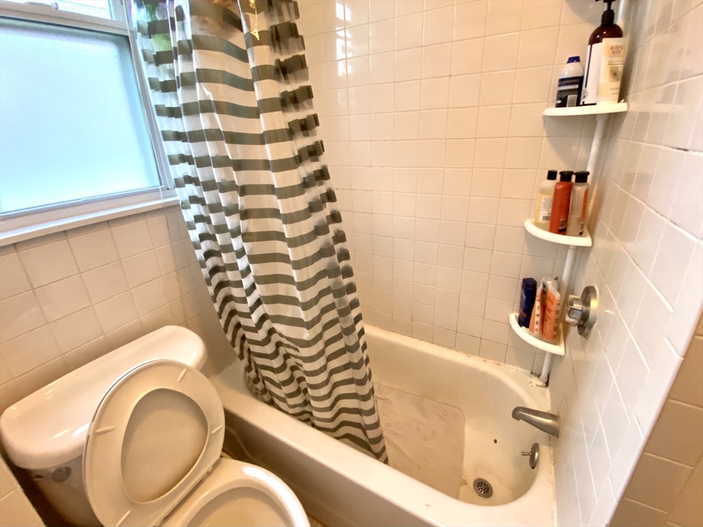 3 Oswald Street, Unit 3 Boston, MA 02120 - Photo 20 of 23 a bathroom with a bathtub and shower