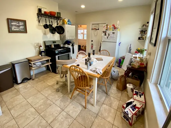 a living room with furniture and a mirror