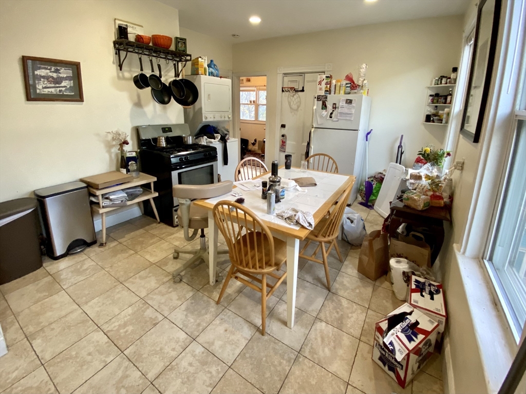 3 Oswald Street, Unit 3 Boston, MA 02120 - Photo 21 of 23 a living room with furniture and a mirror