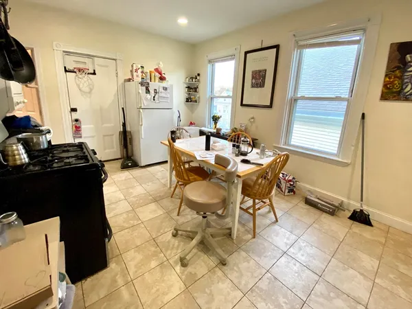 a living room with patio furniture and a window