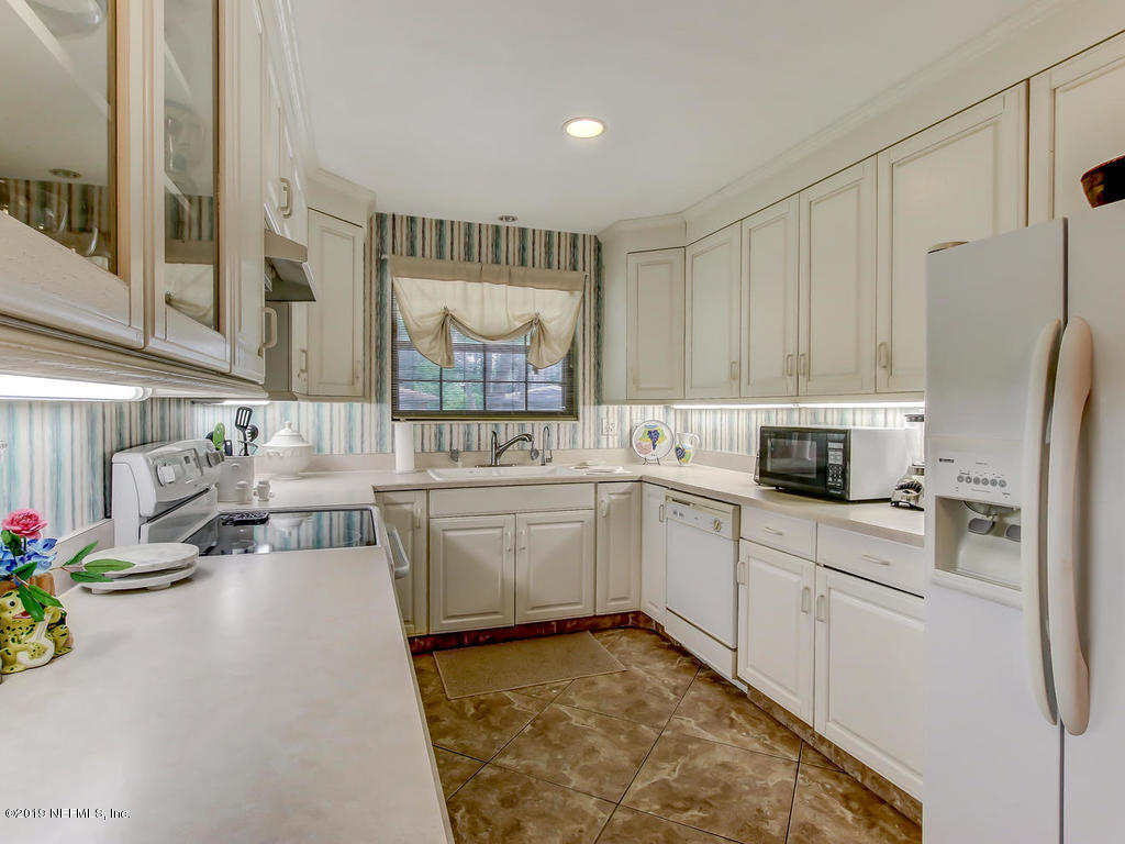 365 9th Street Atlantic Beach, FL 32233 - Photo 11 of 37 a kitchen with a sink cabinets and window