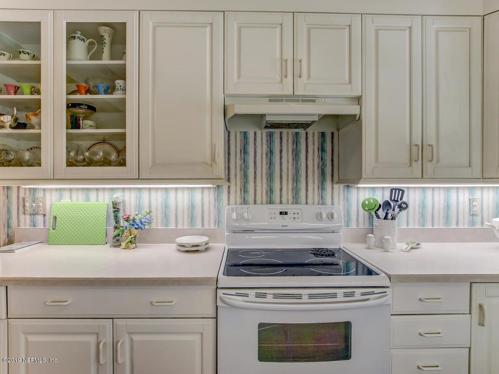 365 9th Street Atlantic Beach, FL 32233 - Photo 12 of 37 a kitchen with a stove and cabinets