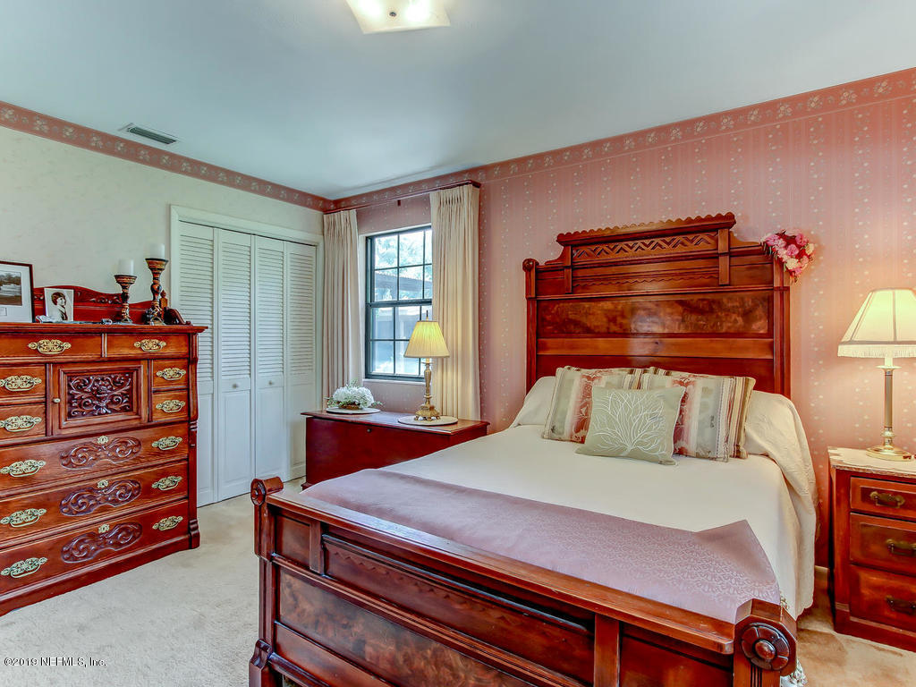365 9th Street Atlantic Beach, FL 32233 - Photo 19 of 37 a bedroom with a bed and a dresser