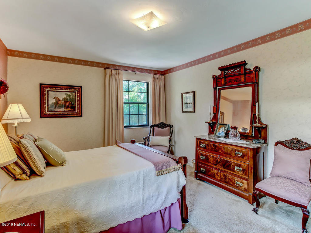 365 9th Street Atlantic Beach, FL 32233 - Photo 20 of 37 a bedroom with a bed and wooden floor