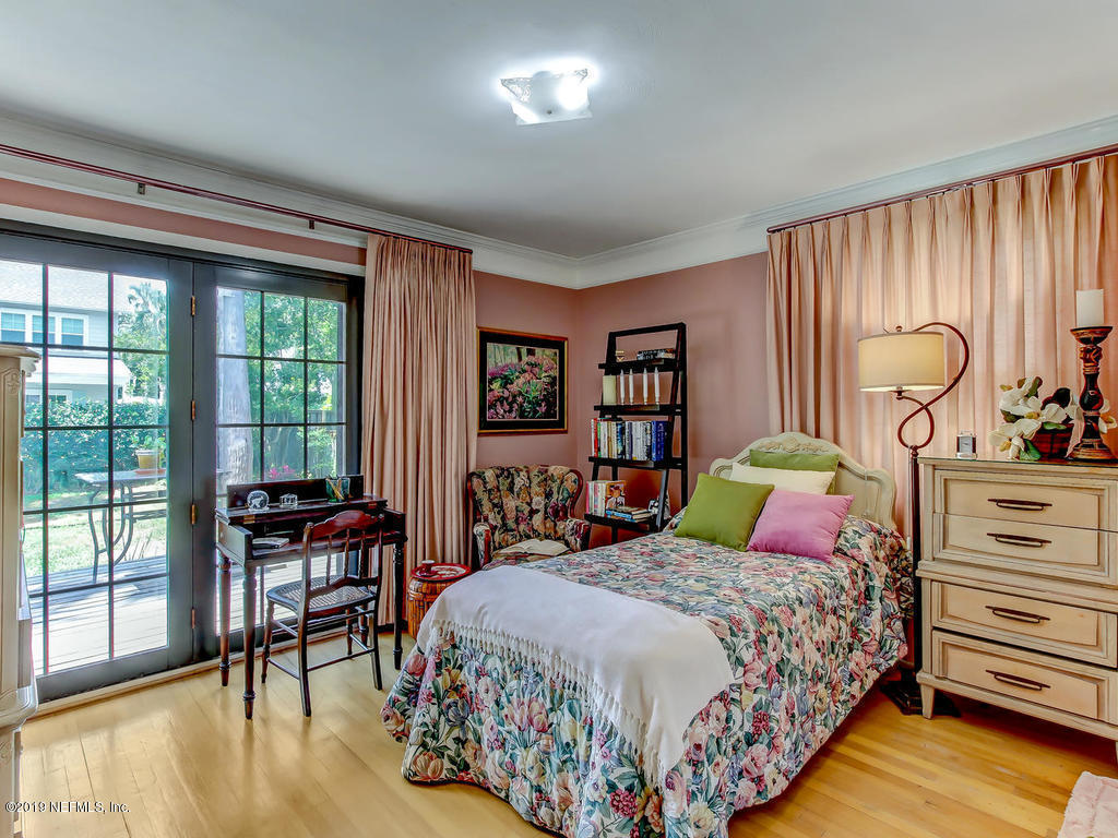365 9th Street Atlantic Beach, FL 32233 - Photo 26 of 37 a bedroom with a bed and large windows