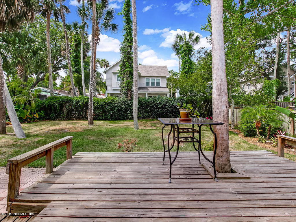365 9th Street Atlantic Beach, FL 32233 - Photo 35 of 37 a view of a deck with chairs and a yard