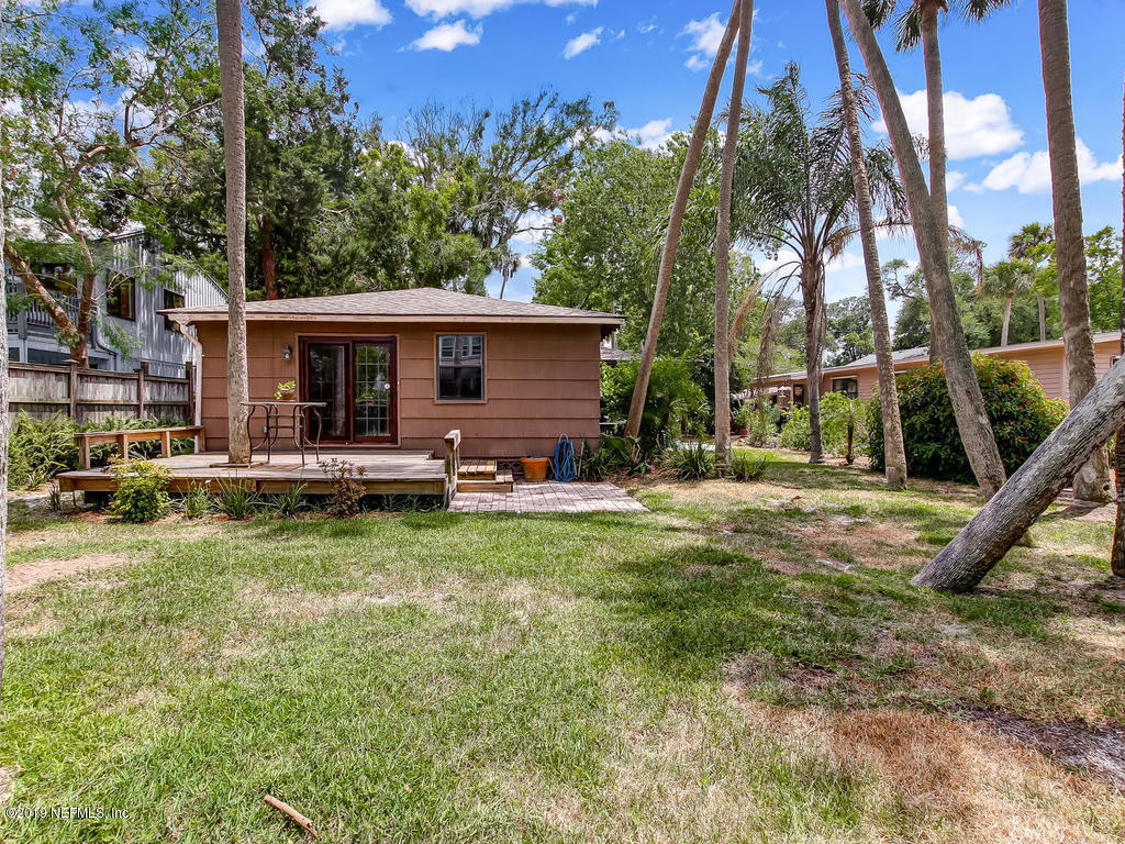 365 9th Street Atlantic Beach, FL 32233 - Photo 37 of 37 a backyard of a house with barbeque oven table and chairs