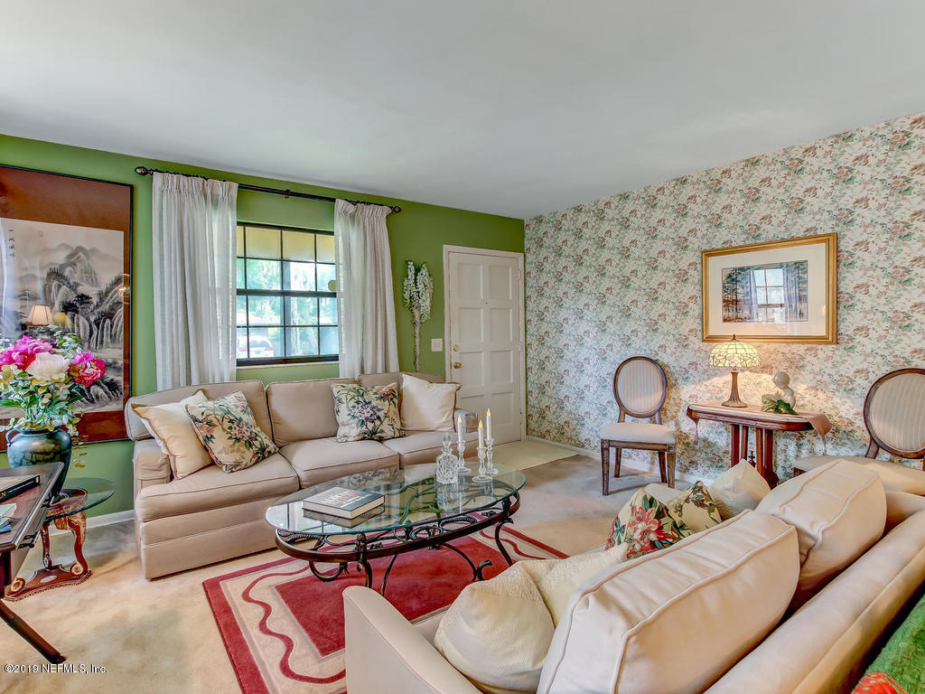 365 9th Street Atlantic Beach, FL 32233 - Photo 5 of 37 a living room with furniture potted plant and a large window