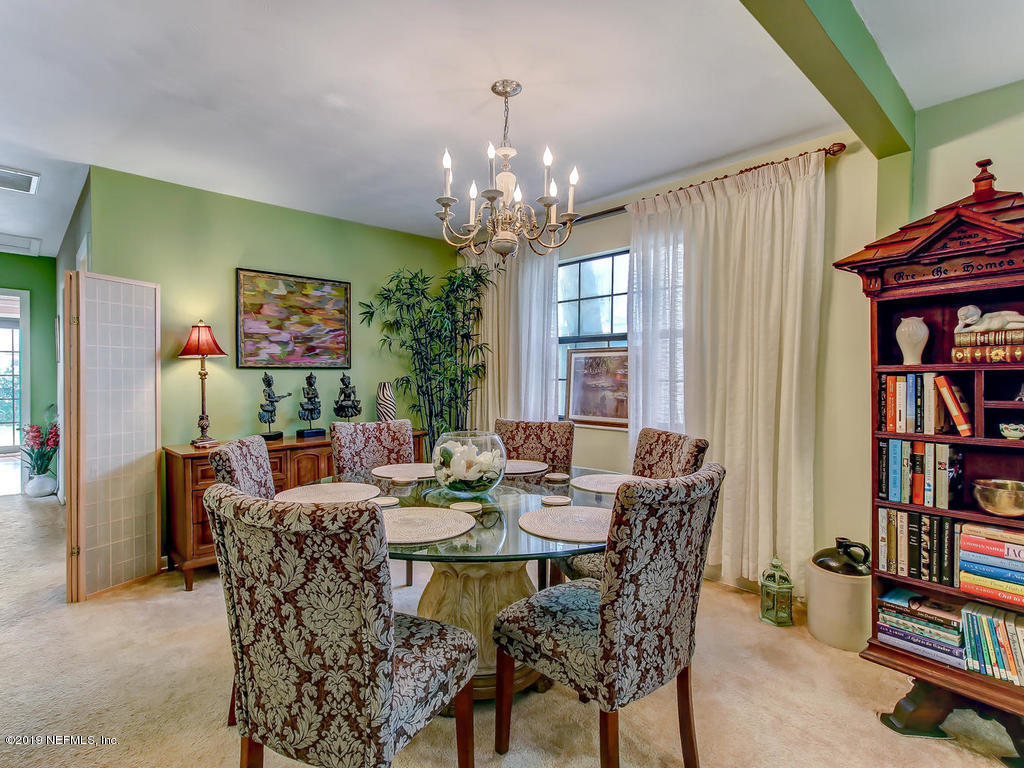 365 9th Street Atlantic Beach, FL 32233 - Photo 7 of 37 a dining room with furniture a rug and a window