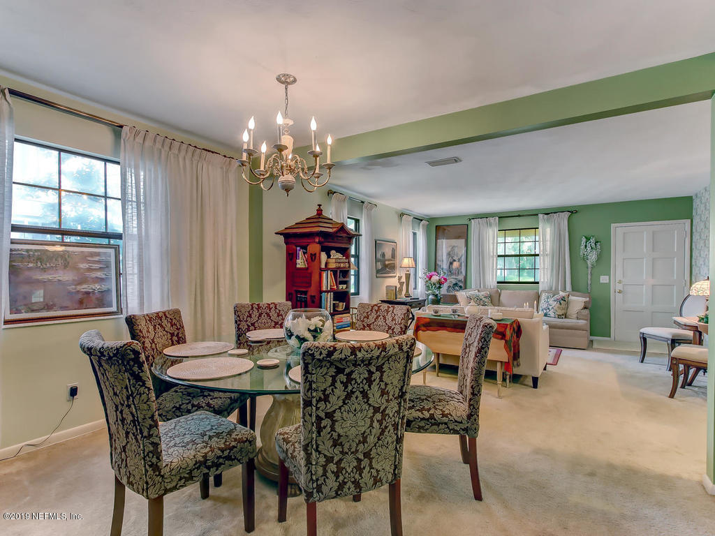 365 9th Street Atlantic Beach, FL 32233 - Photo 8 of 37 a view of a dining room with furniture window and outside view