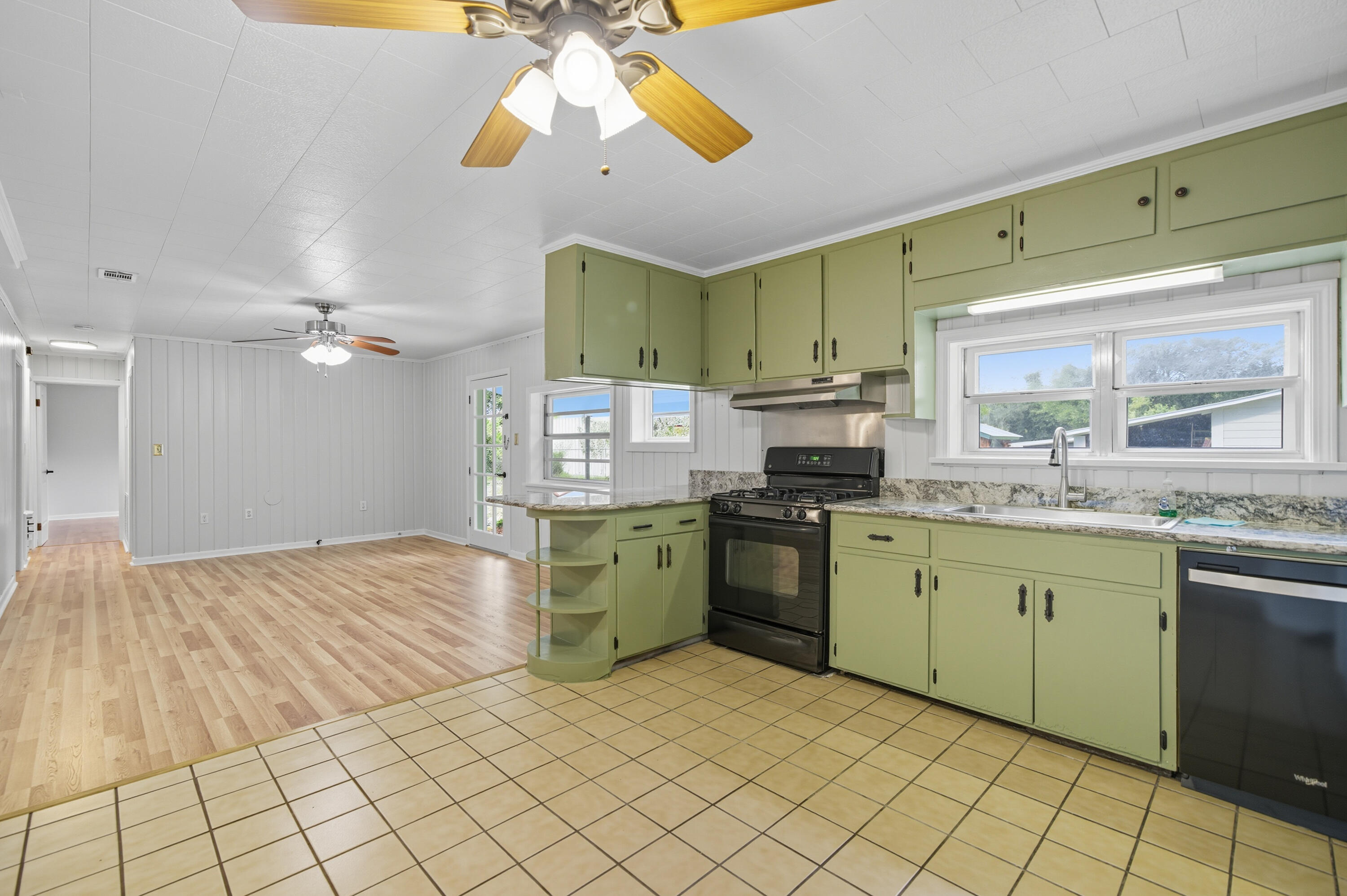 2128 3rd Avenue Crestview, FL 32539 - Photo 13 of 50 a kitchen with a sink cabinets and window