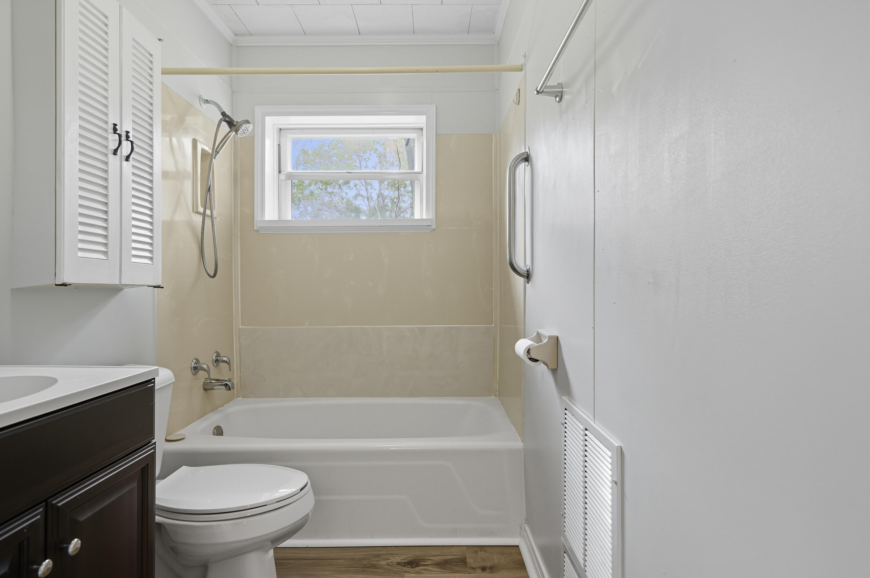 2128 3rd Avenue Crestview, FL 32539 - Photo 29 of 50 a bathroom with a granite countertop toilet a sink and a bathtub