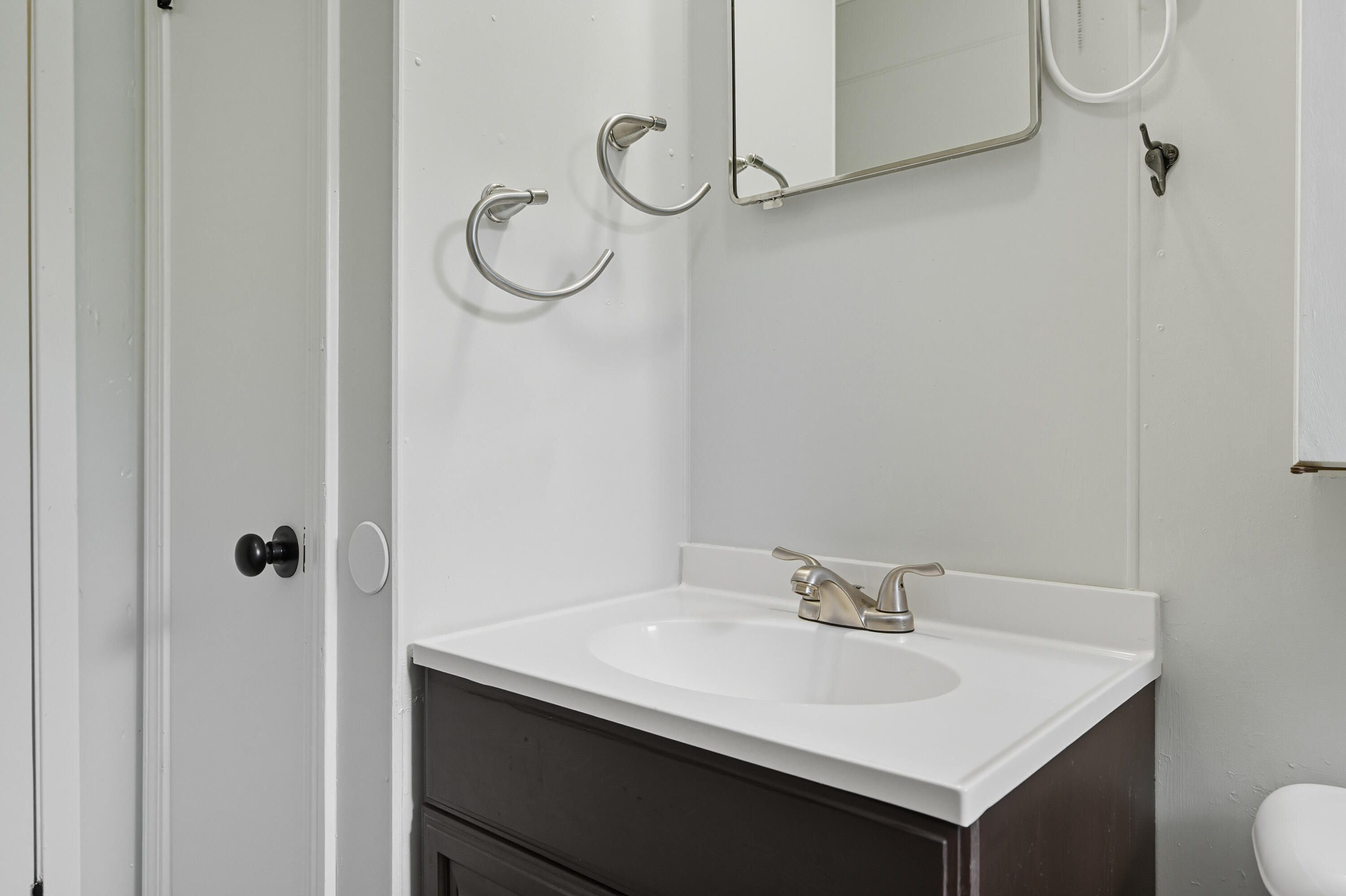 2128 3rd Avenue Crestview, FL 32539 - Photo 30 of 50 a bathroom with a sink and mirror