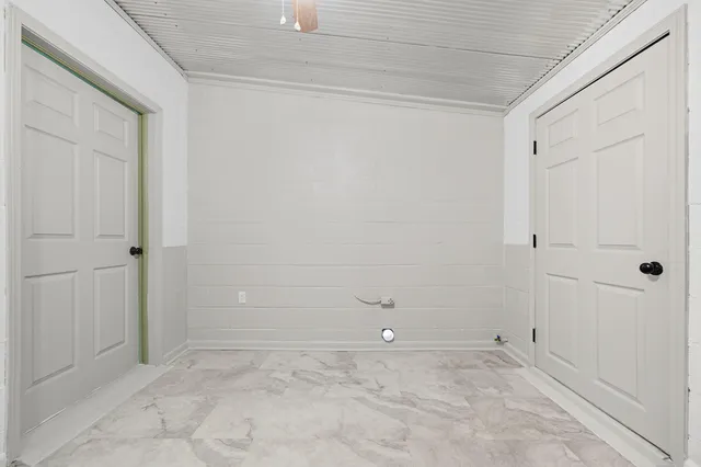 view of a room with lots of different colored cloths