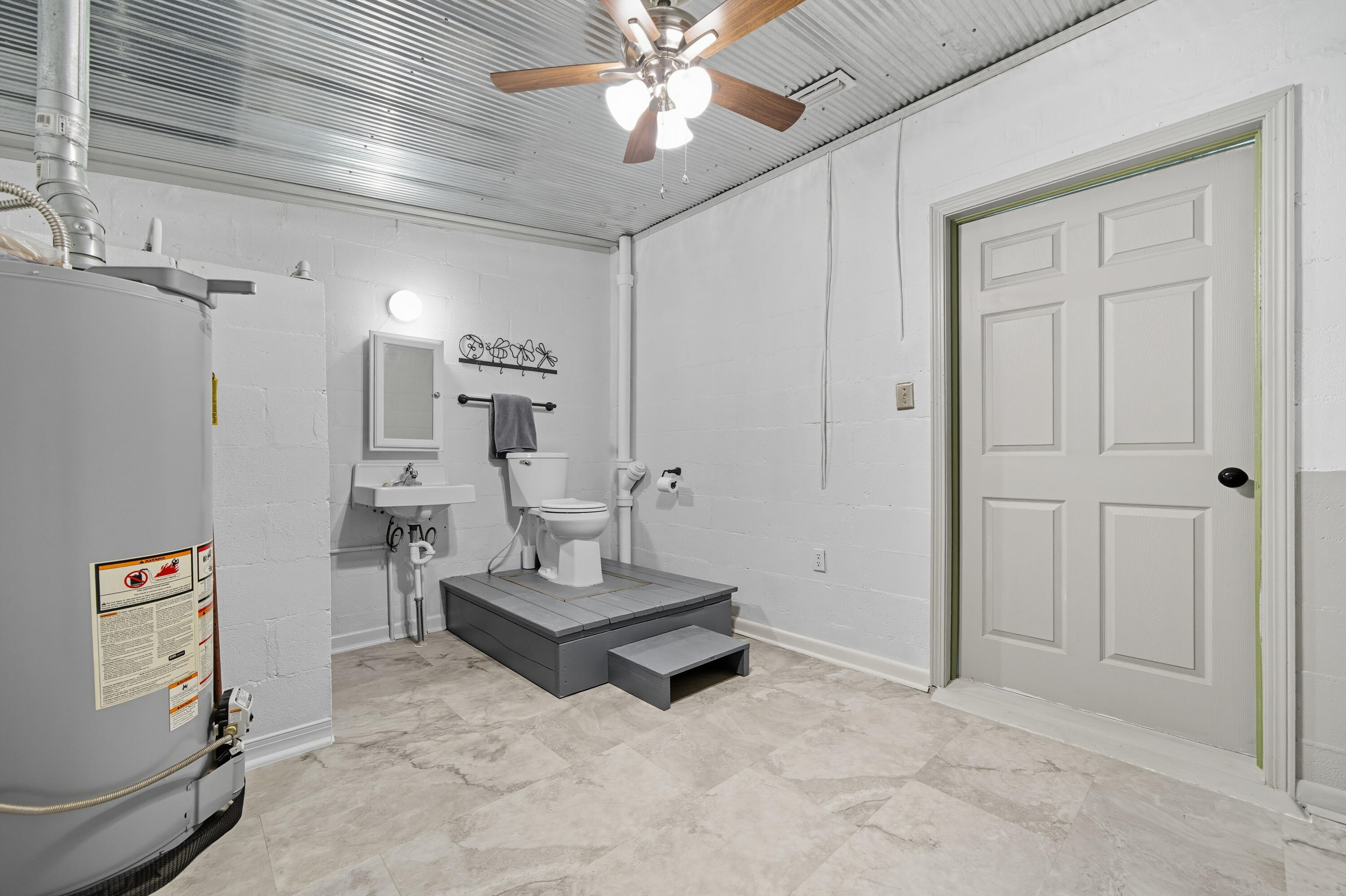 2128 3rd Avenue Crestview, FL 32539 - Photo 33 of 50 a living room with furniture and a chandelier