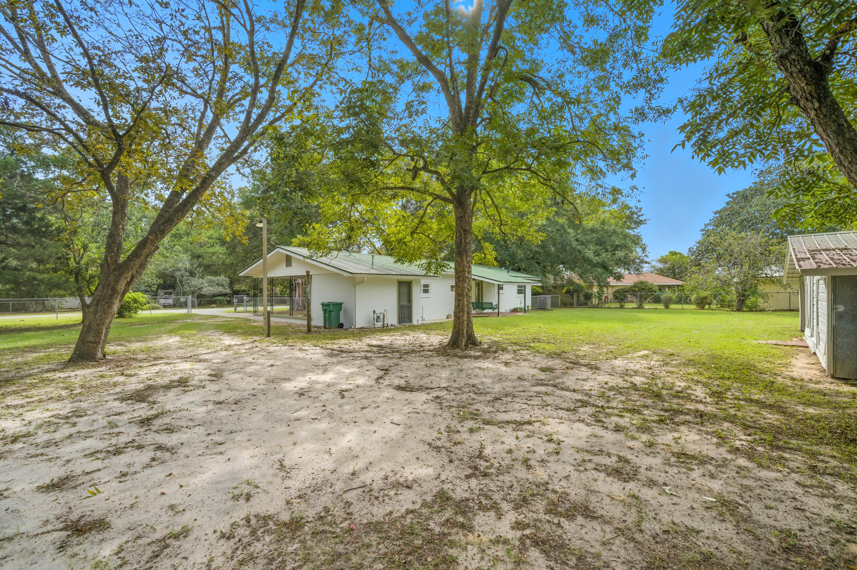2128 3rd Avenue Crestview, FL 32539 - Photo 37 of 50 a view of a house with a yard