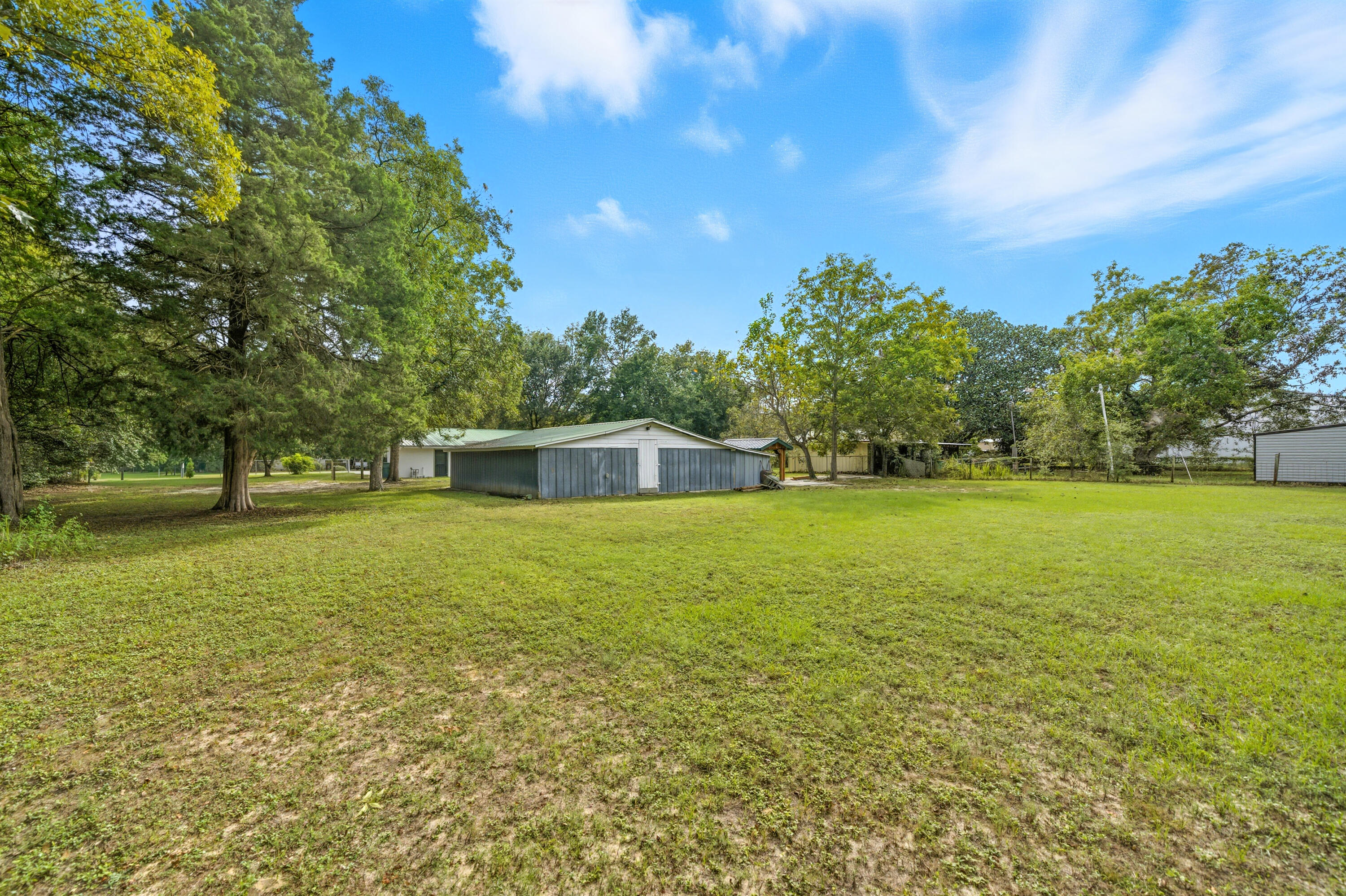 2128 3rd Avenue Crestview, FL 32539 - Photo 38 of 50 a front view of a house with a yard