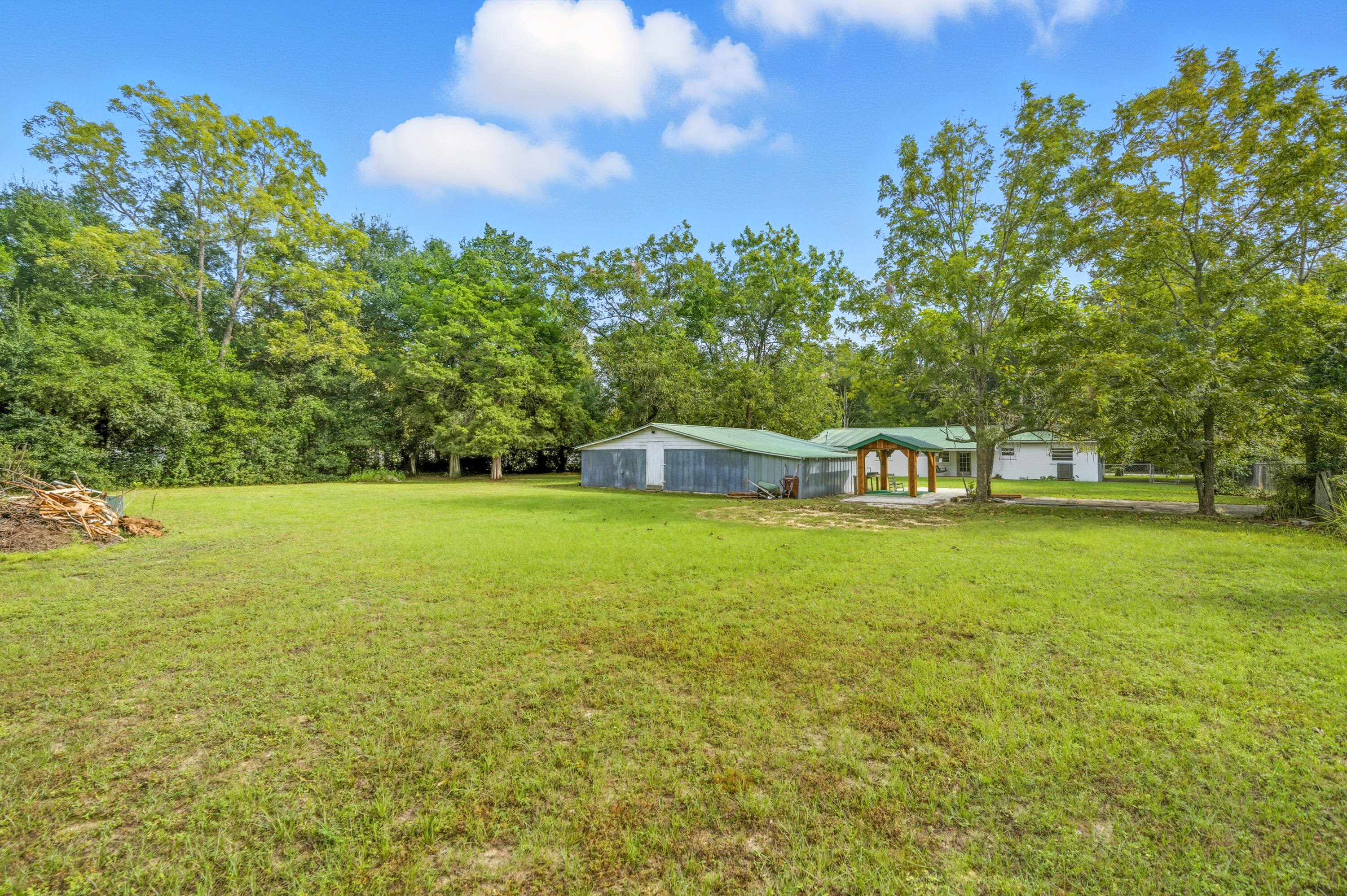 2128 3rd Avenue Crestview, FL 32539 - Photo 39 of 50 a front view of a house with a yard