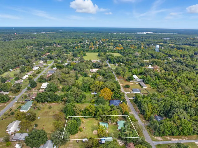 a view of a trees with a yard