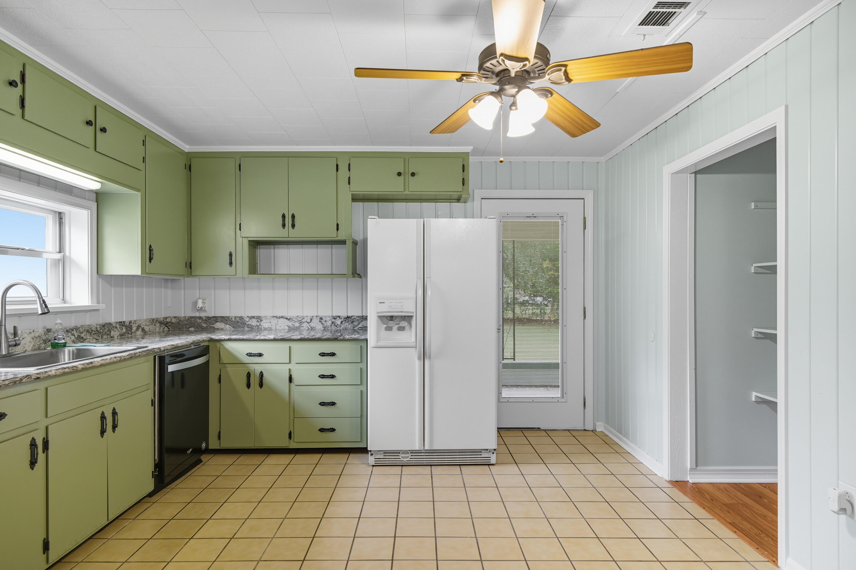 2128 3rd Avenue Crestview, FL 32539 - Photo 9 of 50 a kitchen with a cabinets a sink and appliances