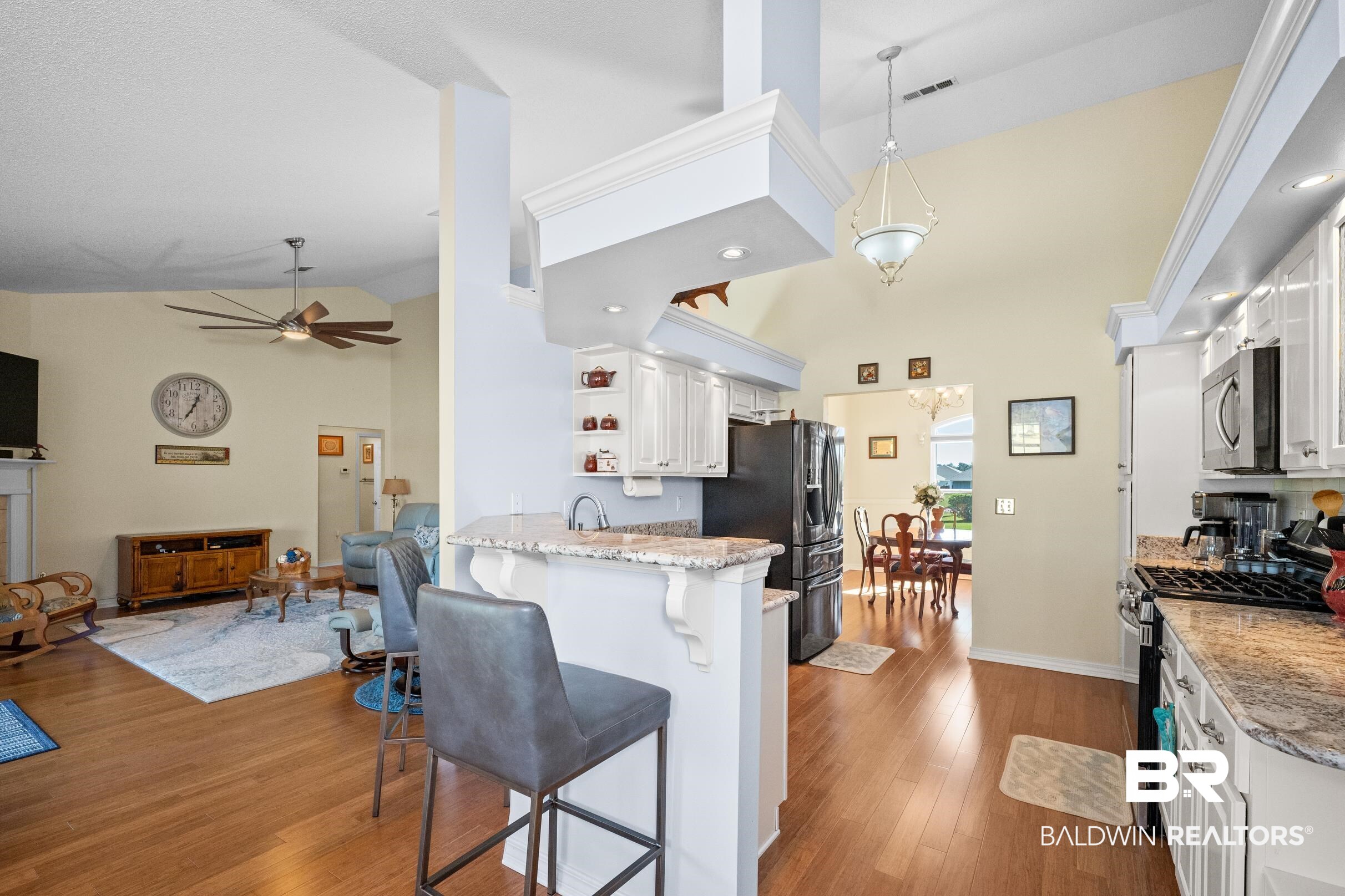 22355 East County Road 12 Foley, AL 36535 - Photo 14 of 54 Kitchen featuring white cabinetry, appliances with stainless steel finishes, open shelves, light wood-style flooring, and high vaulted ceiling