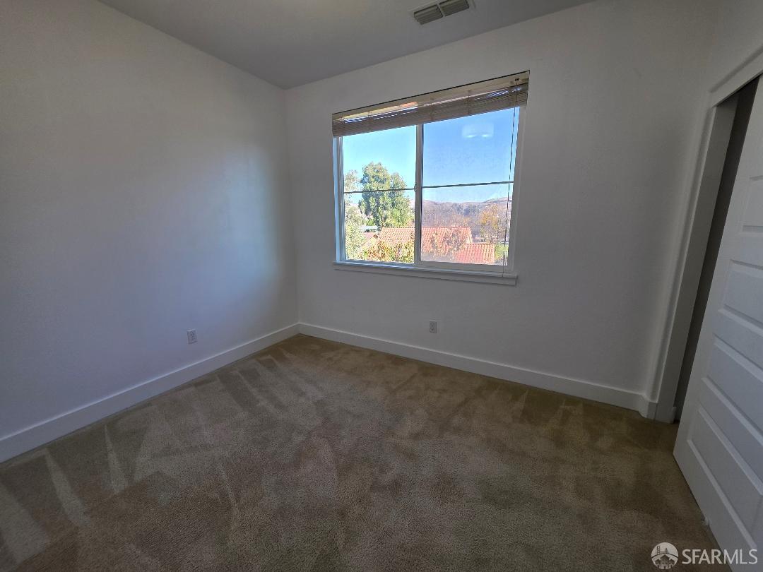 2415 Stearman Court, Unit 7 San Jose, CA 95132 - Photo 4 of 13 an empty room with windows