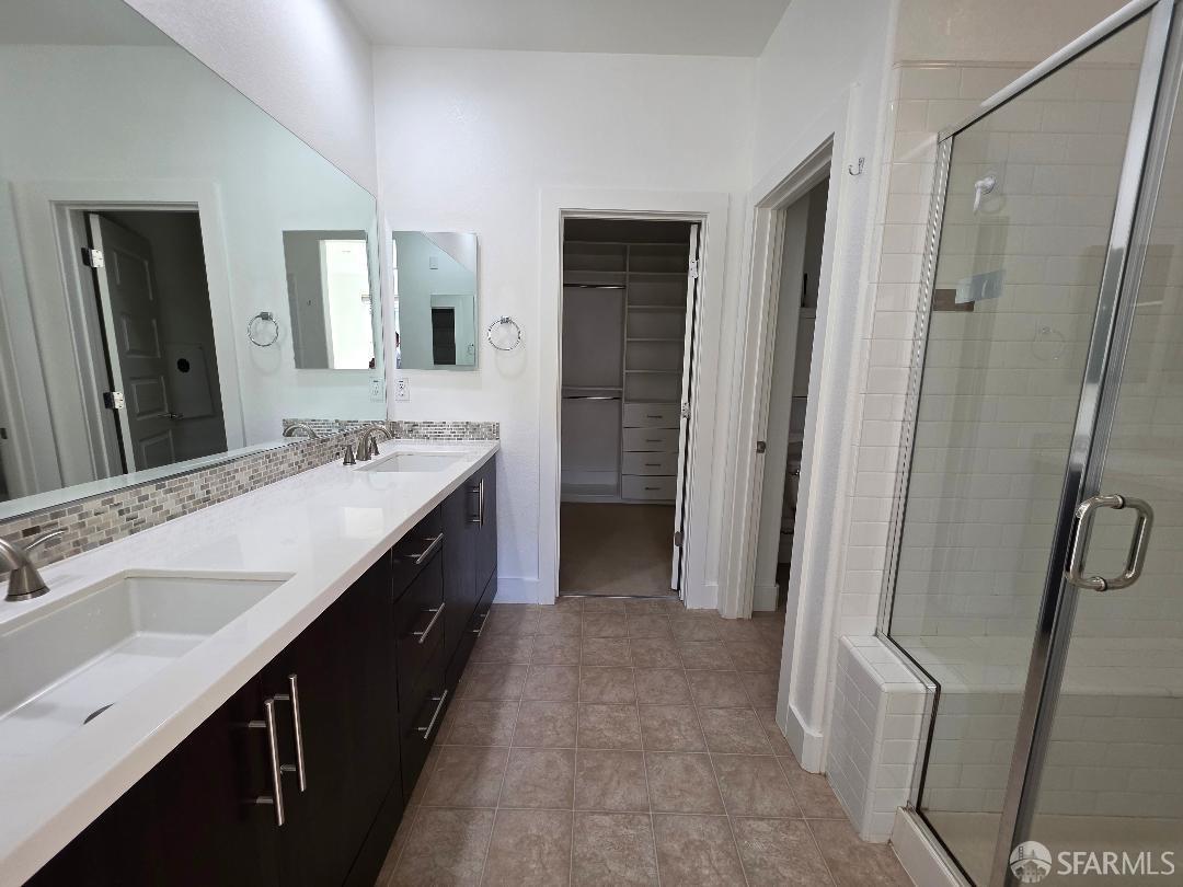 2415 Stearman Court, Unit 7 San Jose, CA 95132 - Photo 7 of 13 a bathroom with a double vanity sink a and mirror