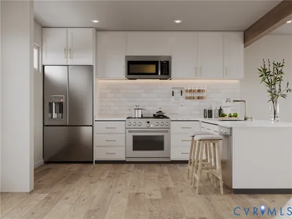 a kitchen with a refrigerator stove and microwave